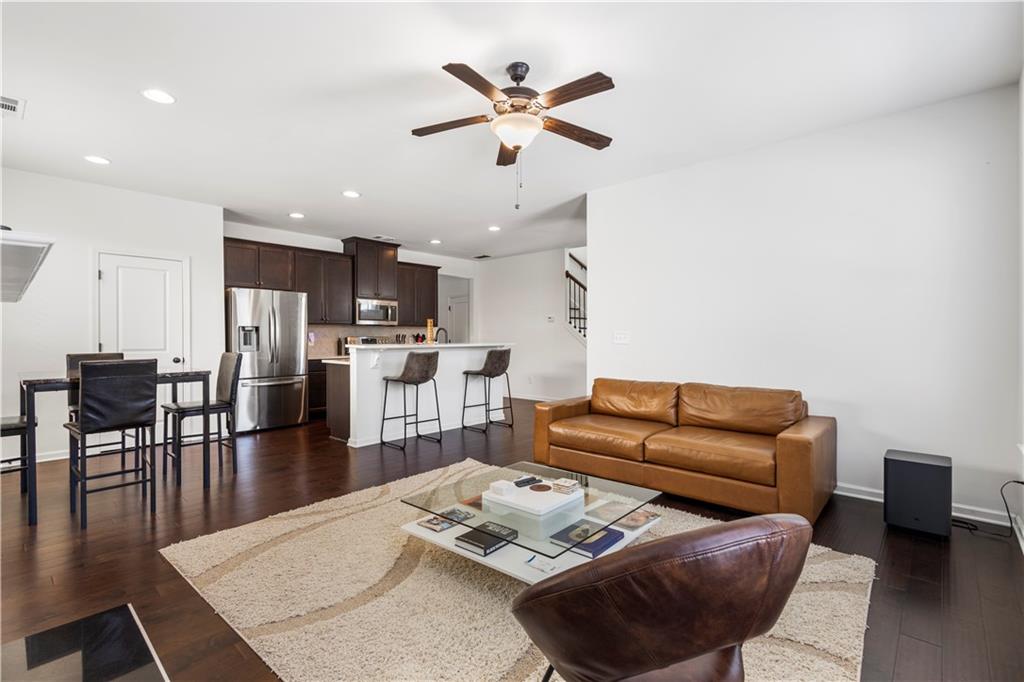 869 Venture Way Atlanta, GA 30331 - Photo 12 of 27 a living room with furniture kitchen view and a dining table