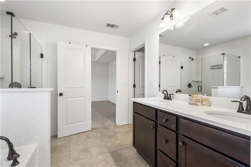 869 Venture Way Atlanta, GA 30331 - Photo 26 of 27 a en suite bathroom with a double vanity sink mirror and double