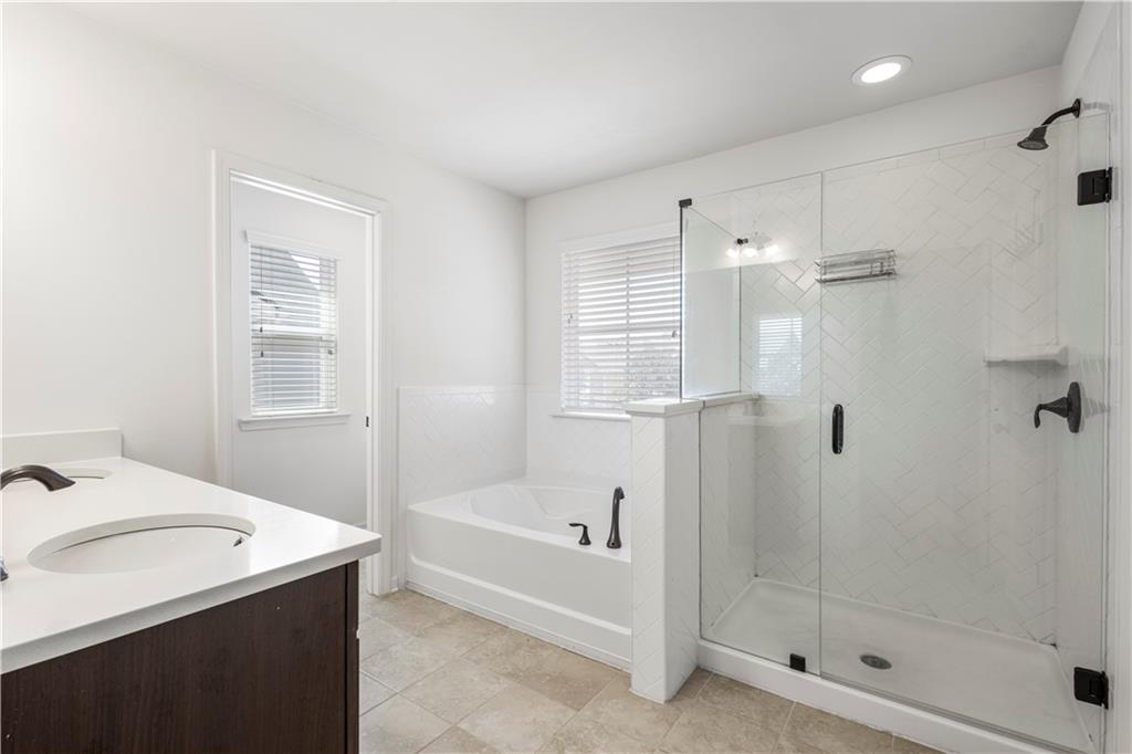 869 Venture Way Atlanta, GA 30331 - Photo 27 of 27 a bathroom with a bath tub and a shower