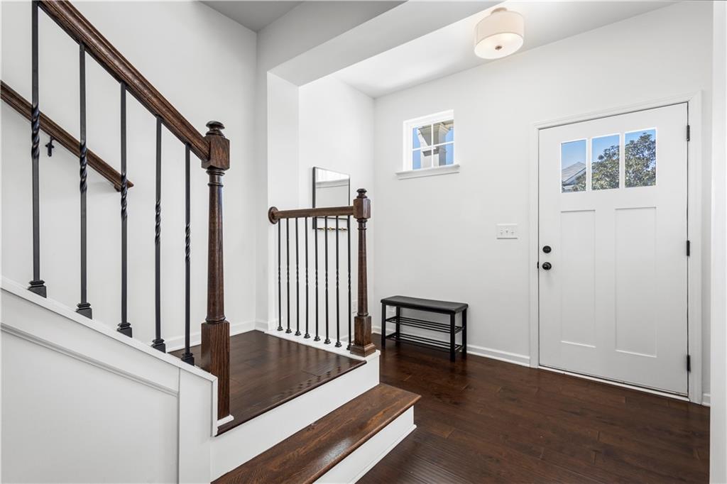 869 Venture Way Atlanta, GA 30331 - Photo 5 of 27 a view of staircase with furniture and wooden floor