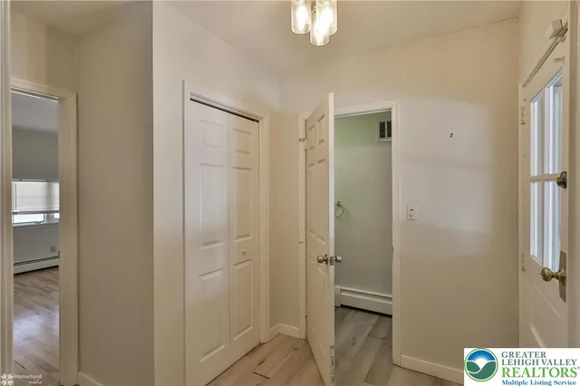 a bathroom with a shower and a sink