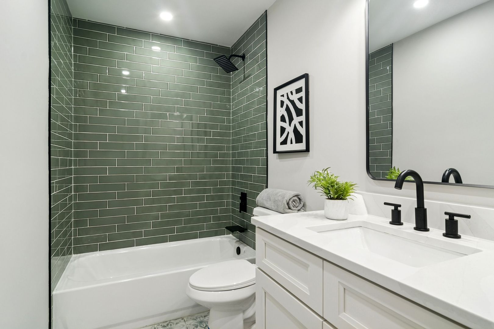 1420 Hassell Road Hoffman Estates, IL 60169 - Photo 14 of 26 a bathroom with a sink a toilet and shower