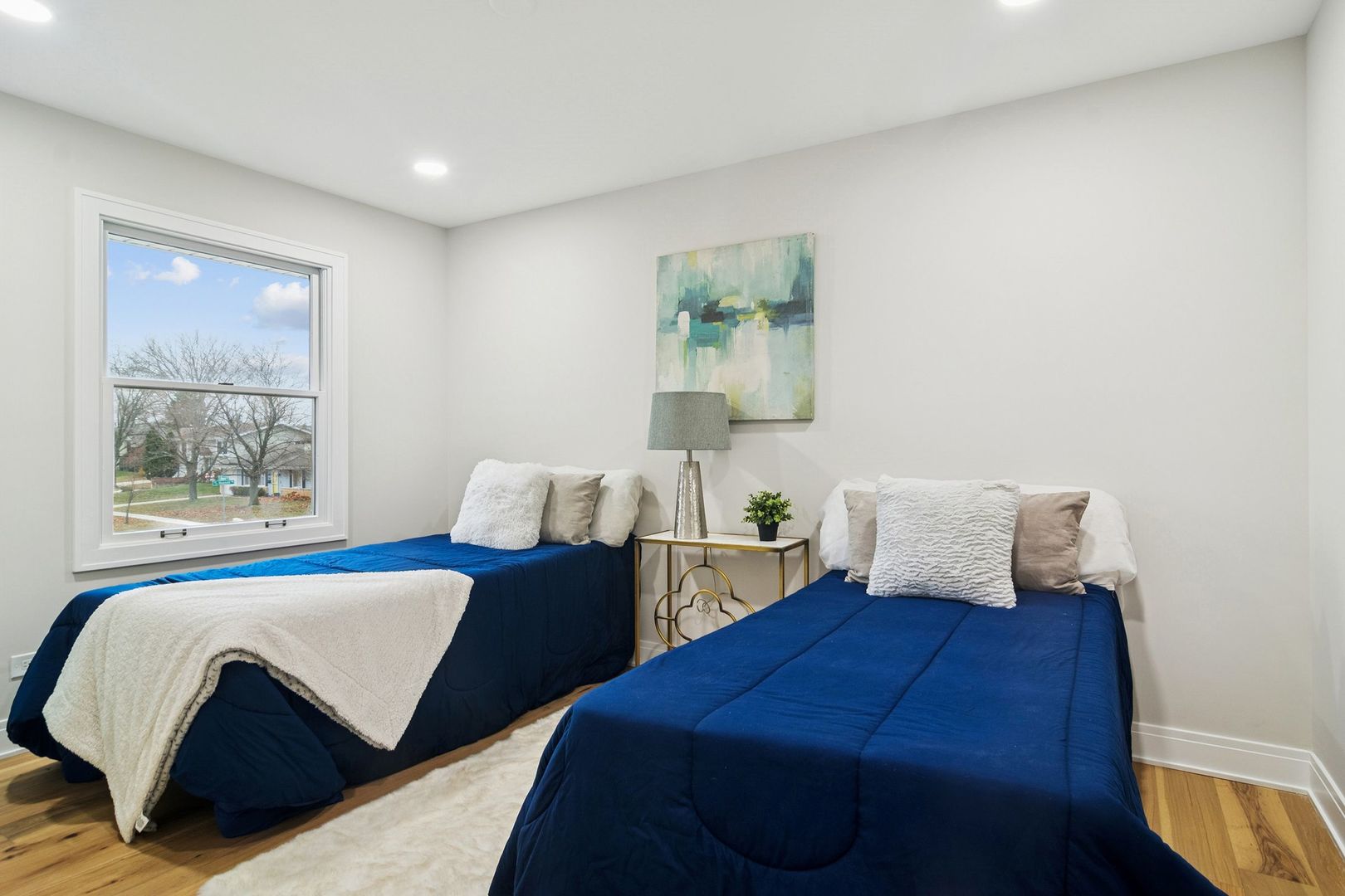 1420 Hassell Road Hoffman Estates, IL 60169 - Photo 16 of 26 a bedroom with two beds and a window