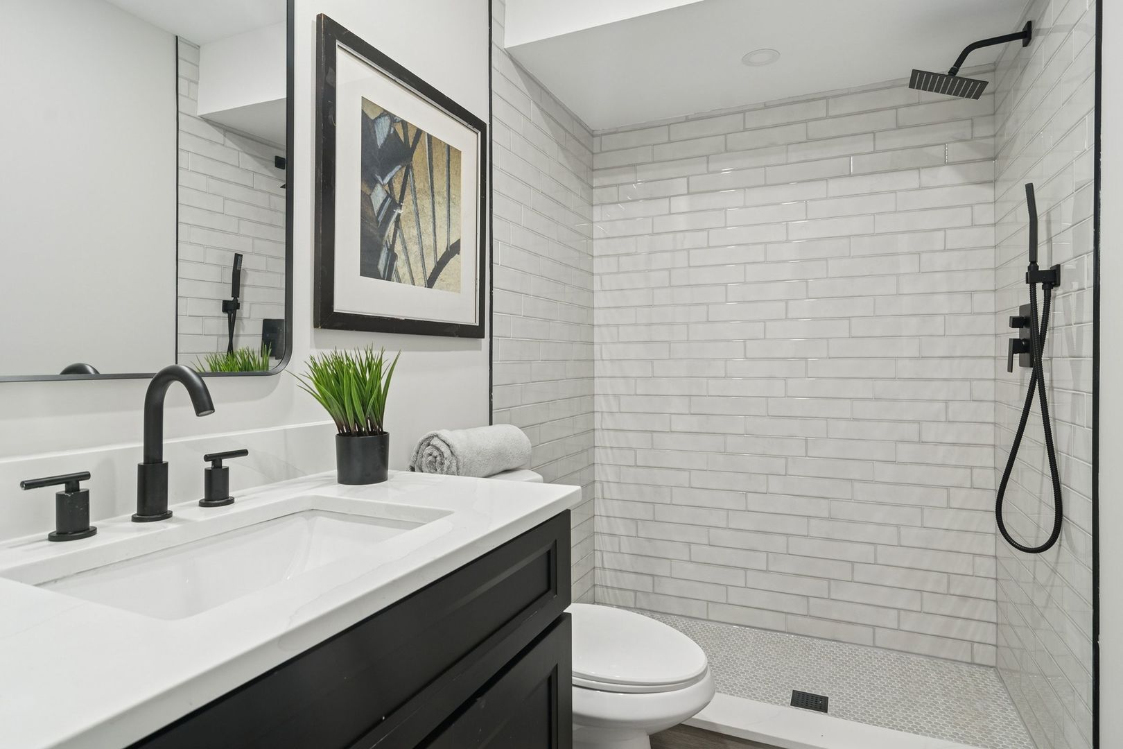 1420 Hassell Road Hoffman Estates, IL 60169 - Photo 20 of 26 a bathroom with a granite countertop sink a toilet and shower