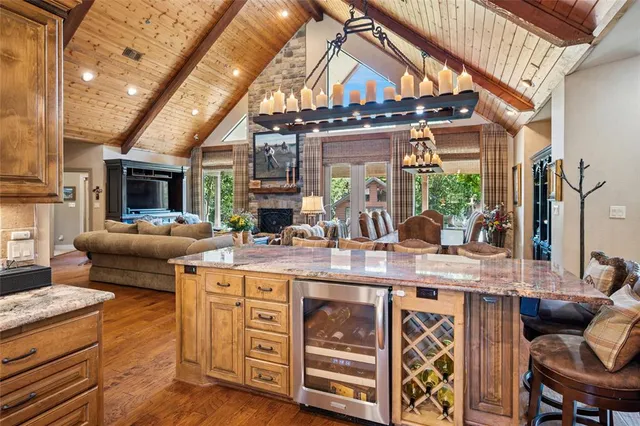 a kitchen with cabinets and chairs
