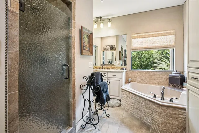 a bathroom with a bathtub and a shower