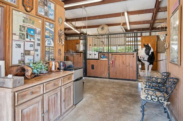 a large bed in a bedroom next to a window