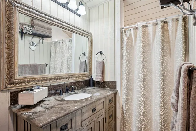 a living room with furniture a flat screen tv and a large window