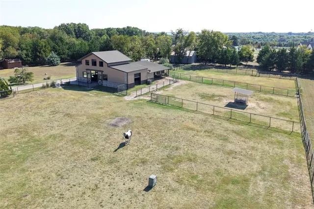 an aerial view of a house with a outdoor space