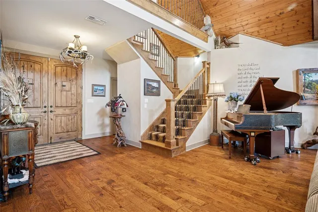 a view of a livingroom with furniture and front door