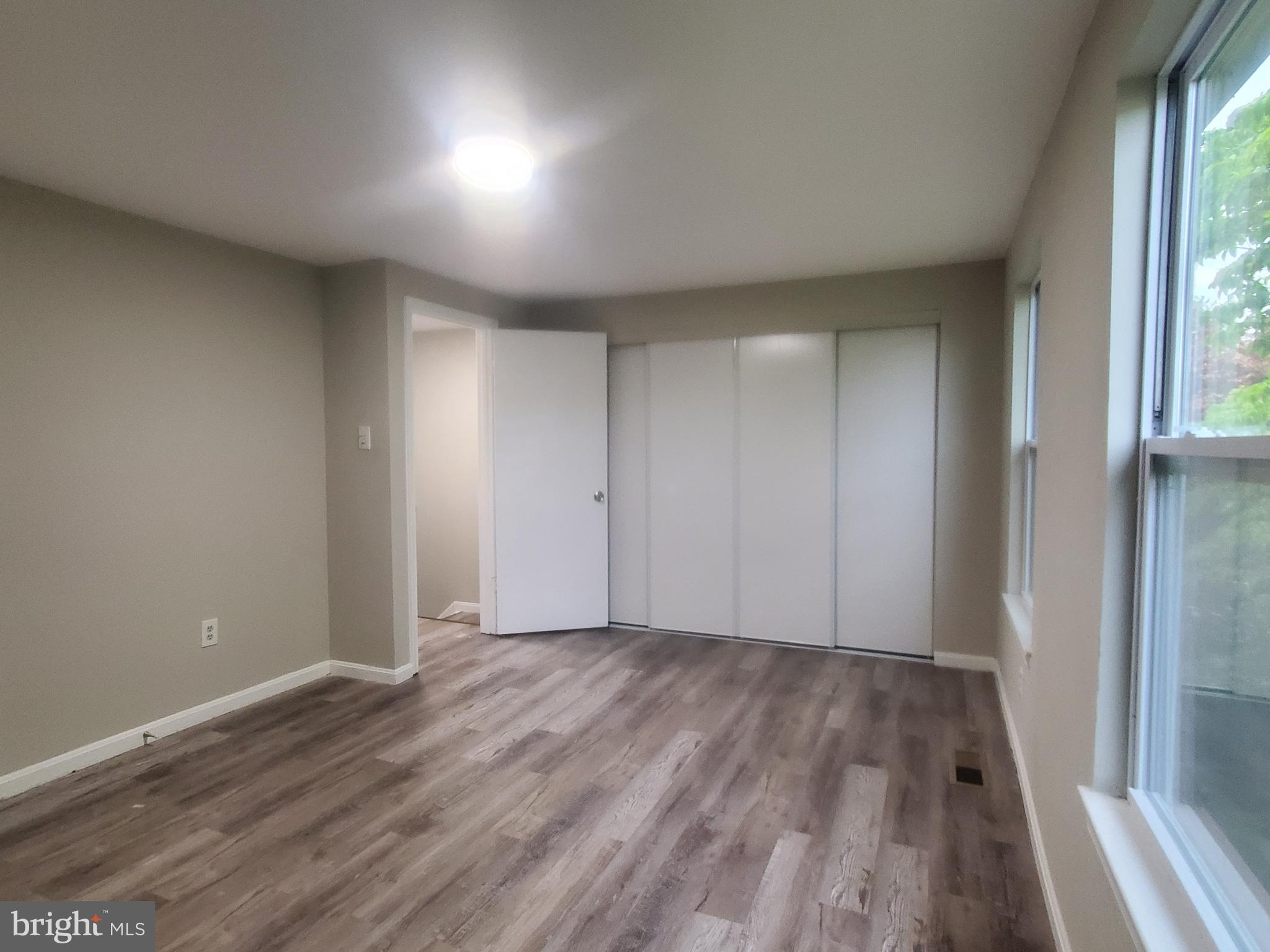 14813 Hammersmith Circle Silver Spring, MD 20906 - Photo 14 of 36 wooden floor in an empty room with a window
