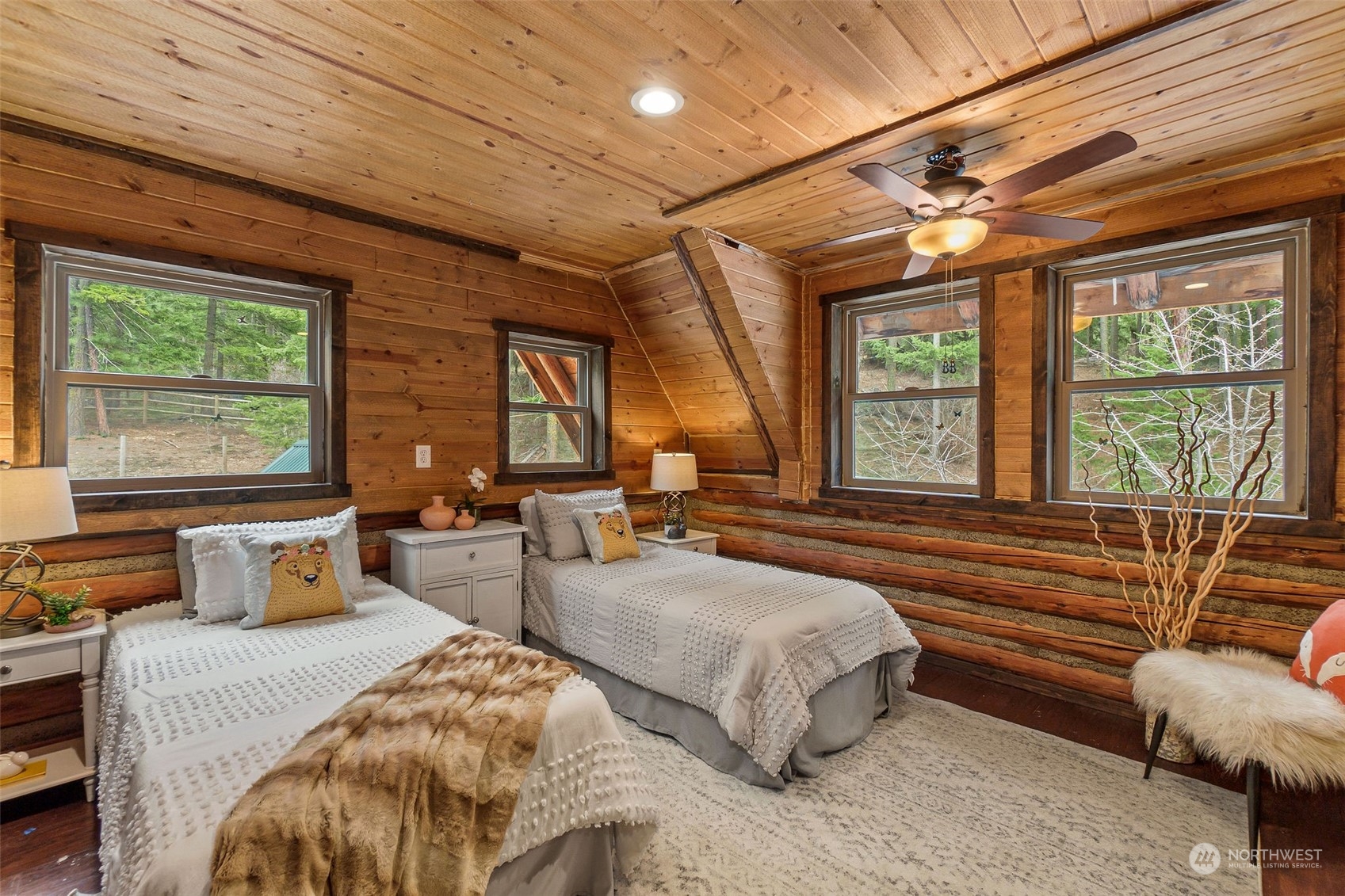 1230 Casassa Road Cle Elum, WA 98922 - Photo 14 of 40 a spacious bedroom with two beds and large windows