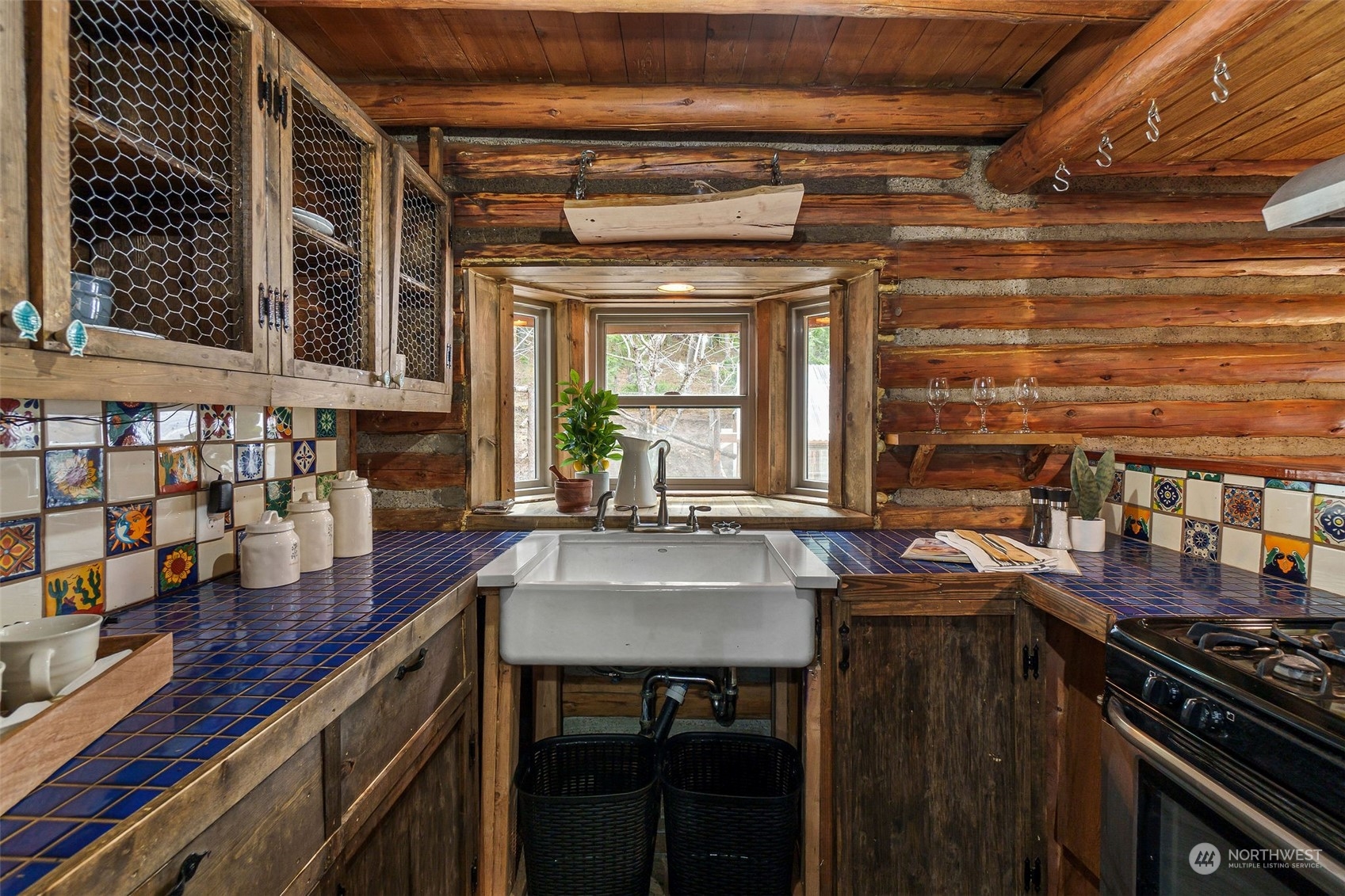 1230 Casassa Road Cle Elum, WA 98922 - Photo 4 of 40 a kitchen with a stove and a wooden cabinets