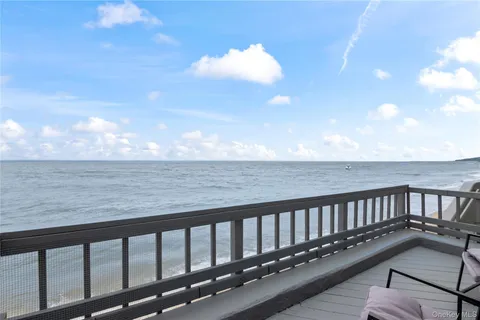 a balcony with wooden floor