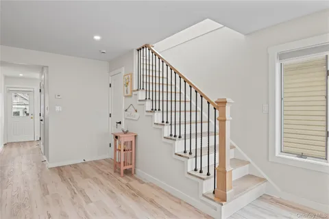 a view of entryway with wooden floor