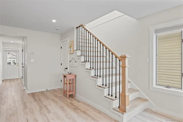 a view of entryway with wooden floor