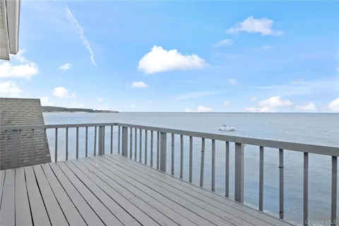 a balcony with wooden floor