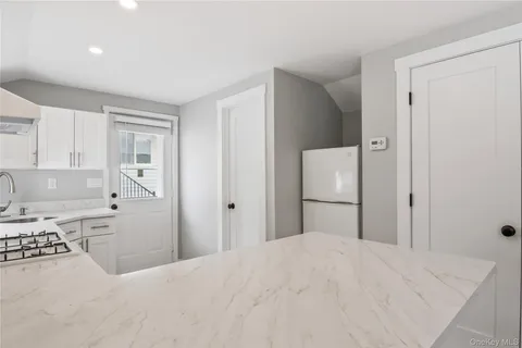 a bedroom with a bed and a cabinets
