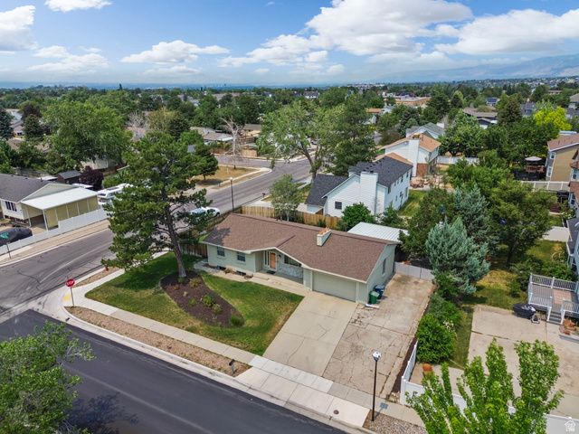 2693 Teal Way Sandy, UT 84093 - Photo 45 of 50 Ranch-style residence featuring a light green exterior with white trim and a brown shingled roof