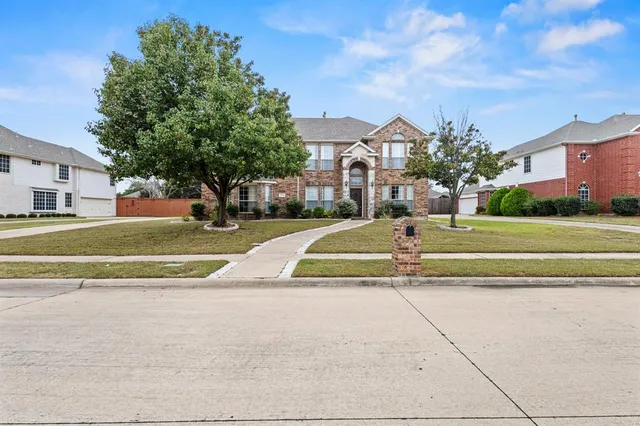 a view of a house with a swimming pool and a yard