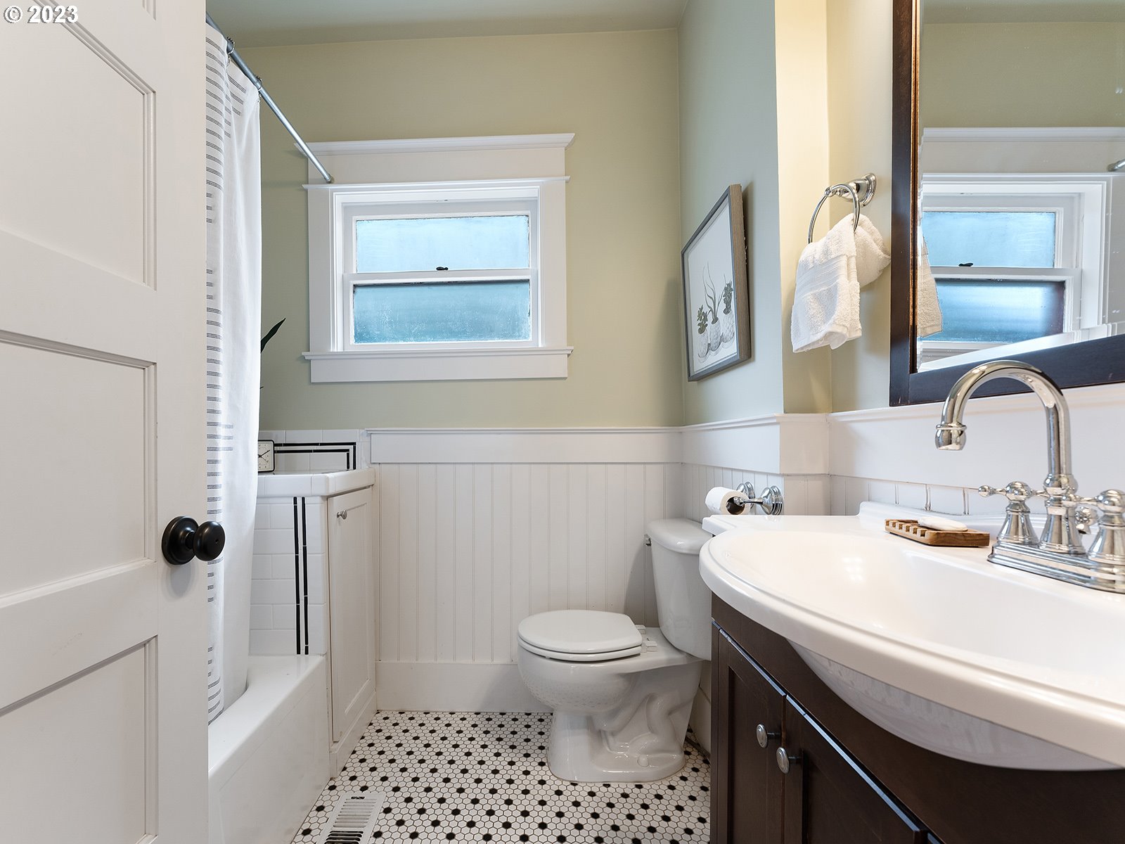 1920 Southeast 47th Avenue Portland, OR 97215 - Photo 19 of 40 a bathroom with a sink a toilet and a mirror
