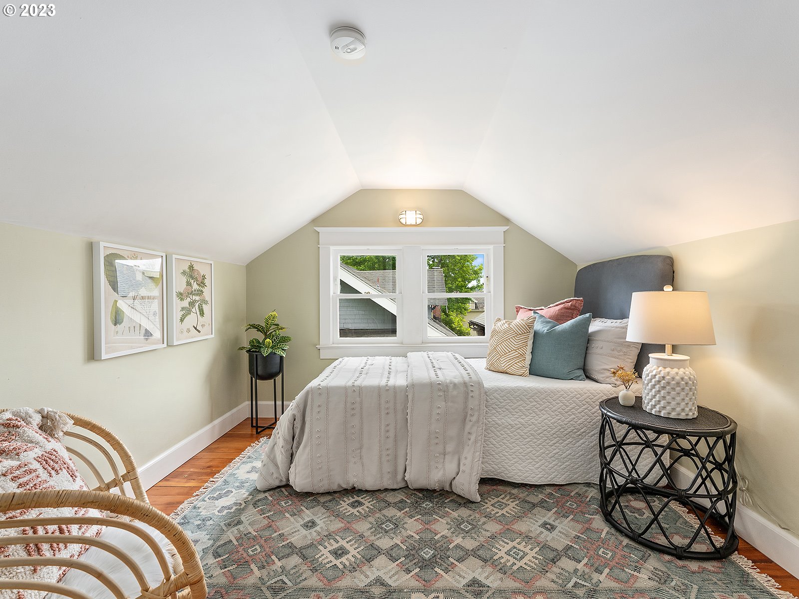 1920 Southeast 47th Avenue Portland, OR 97215 - Photo 26 of 40 a bedroom with a bed and a lamp