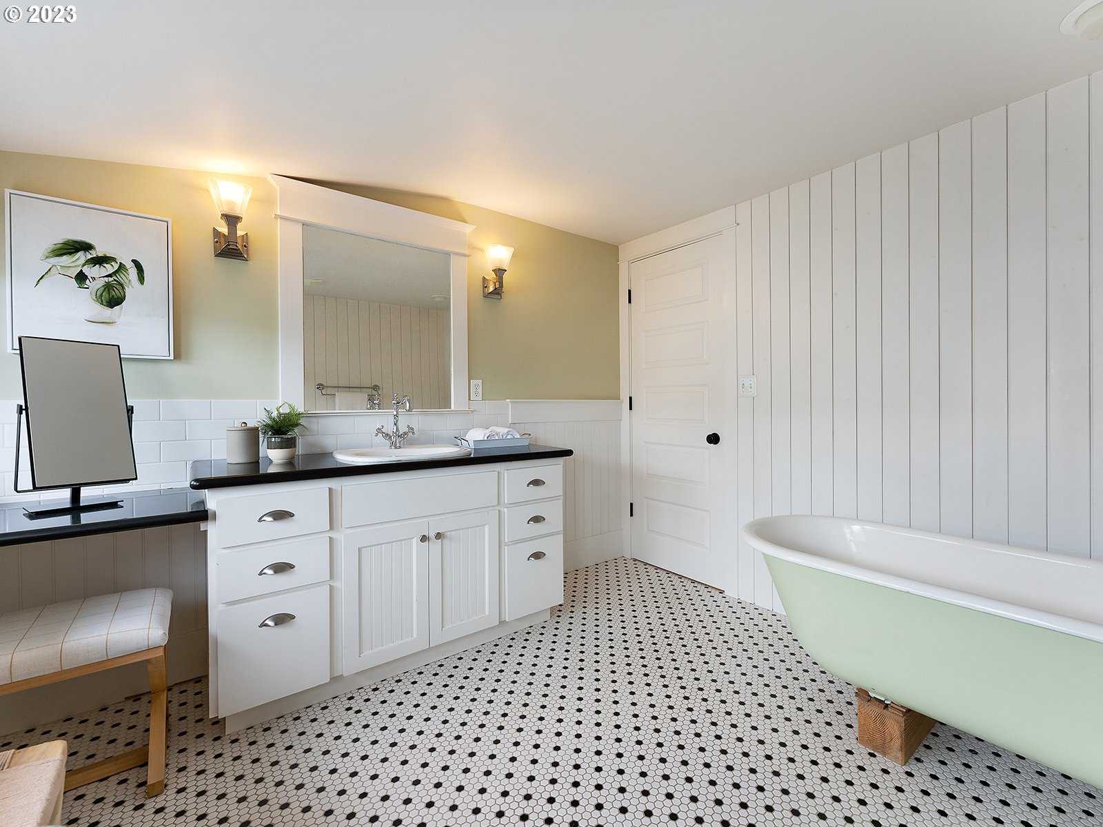 1920 Southeast 47th Avenue Portland, OR 97215 - Photo 29 of 40 a spacious bathroom with a double vanity sink a mirror and a bathtub