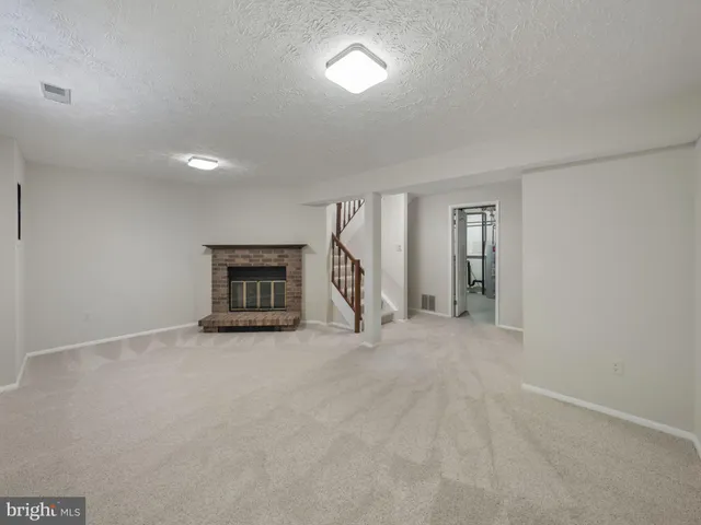 a view of an empty room with stairs
