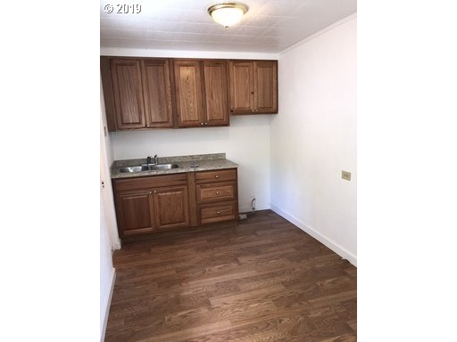 519 Southwest 14th Street Pendleton, OR 97801 - Photo 7 of 11 a view of a kitchen with cabinets