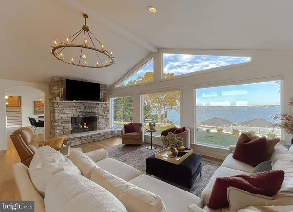 a bed room with a bed and a chandelier