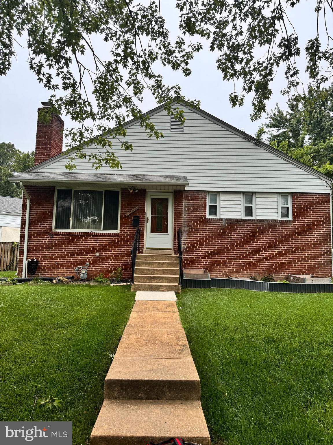 10402 Royalton Terrace Silver Spring, MD 20901 - Photo 1 of 1 a front view of a house with a yard