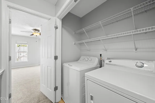 a view of storage and utility room with washer and dryer