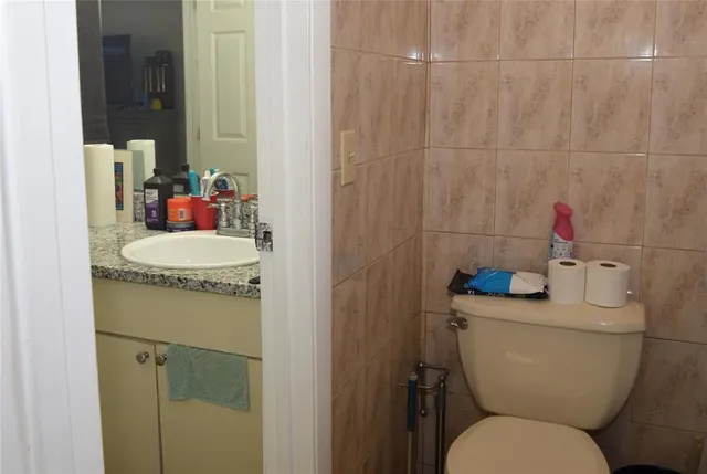 a bathroom with a toilet and a sink
