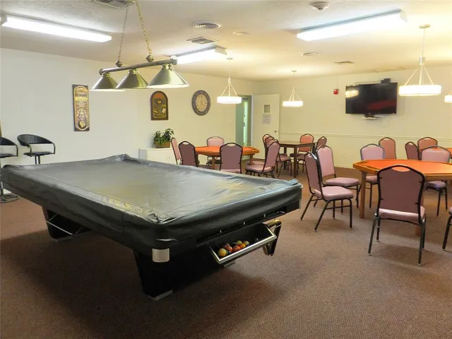 a room with furniture and a flat screen tv