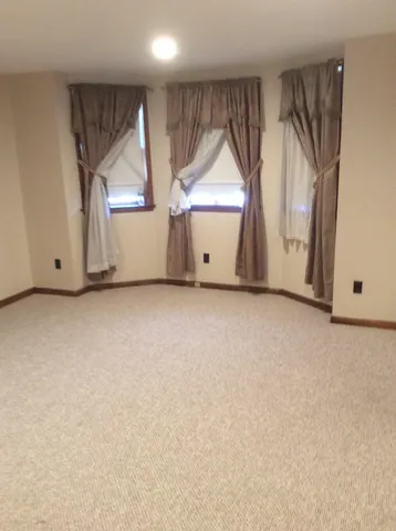 a view of kitchen with window and sink