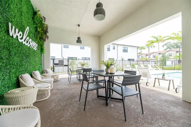 a view of a dining room with furniture window and outside view