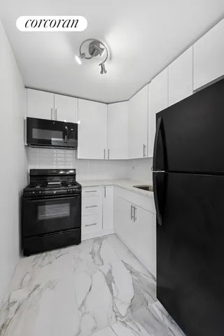 a bedroom with a bed and a mirror