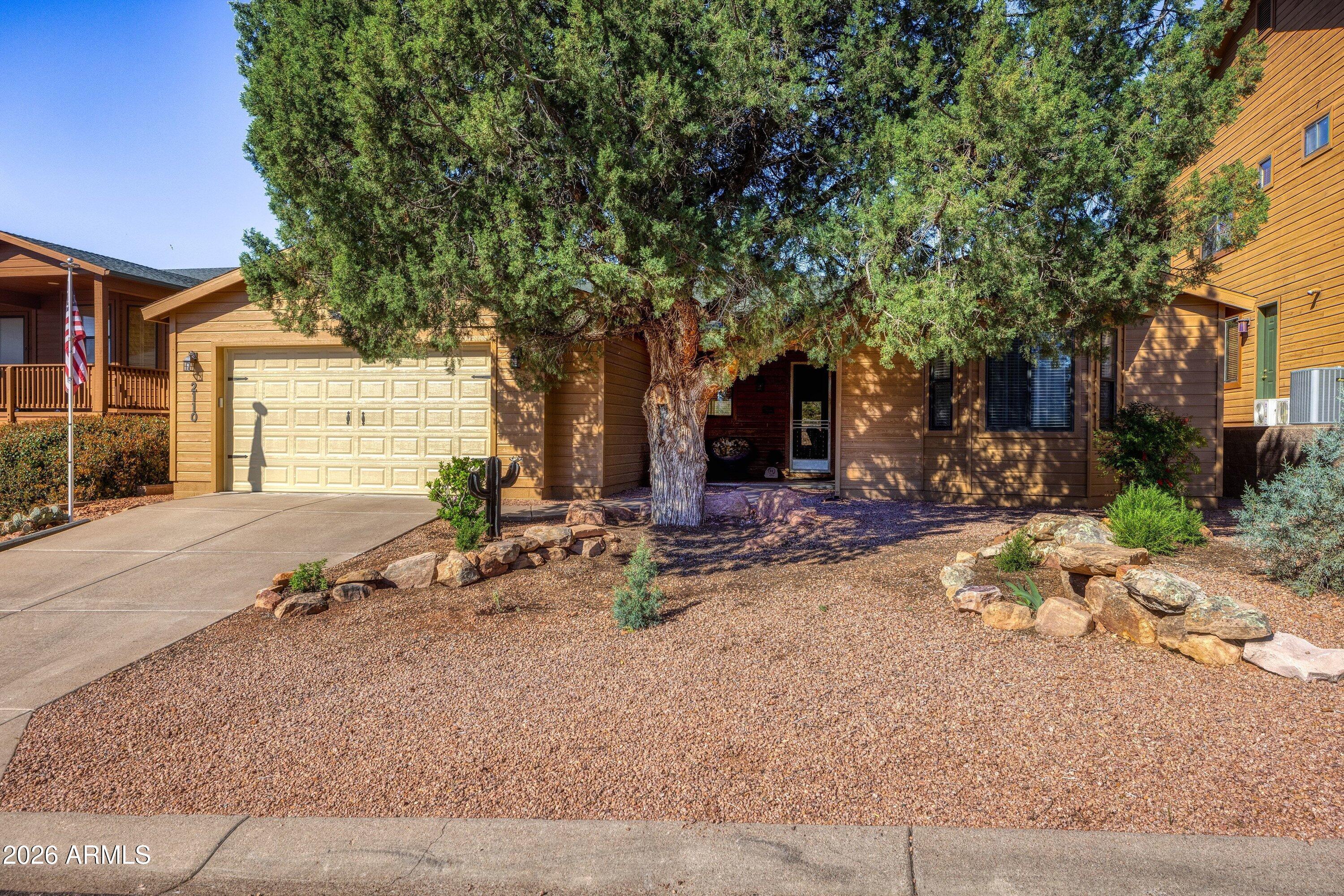 2110 North Cold Springs Point Payson, AZ 85541 - Photo 2 of 29 a row of palm trees in front of a house