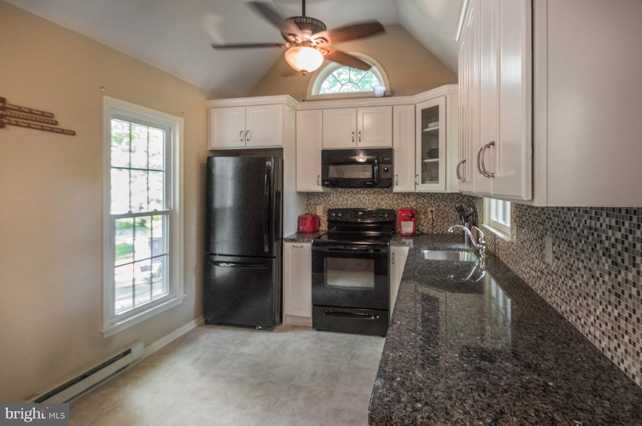 3812 Pippins Place Point of Rocks, MD 21777 - Photo 6 of 19 a kitchen with a refrigerator and a stove top oven