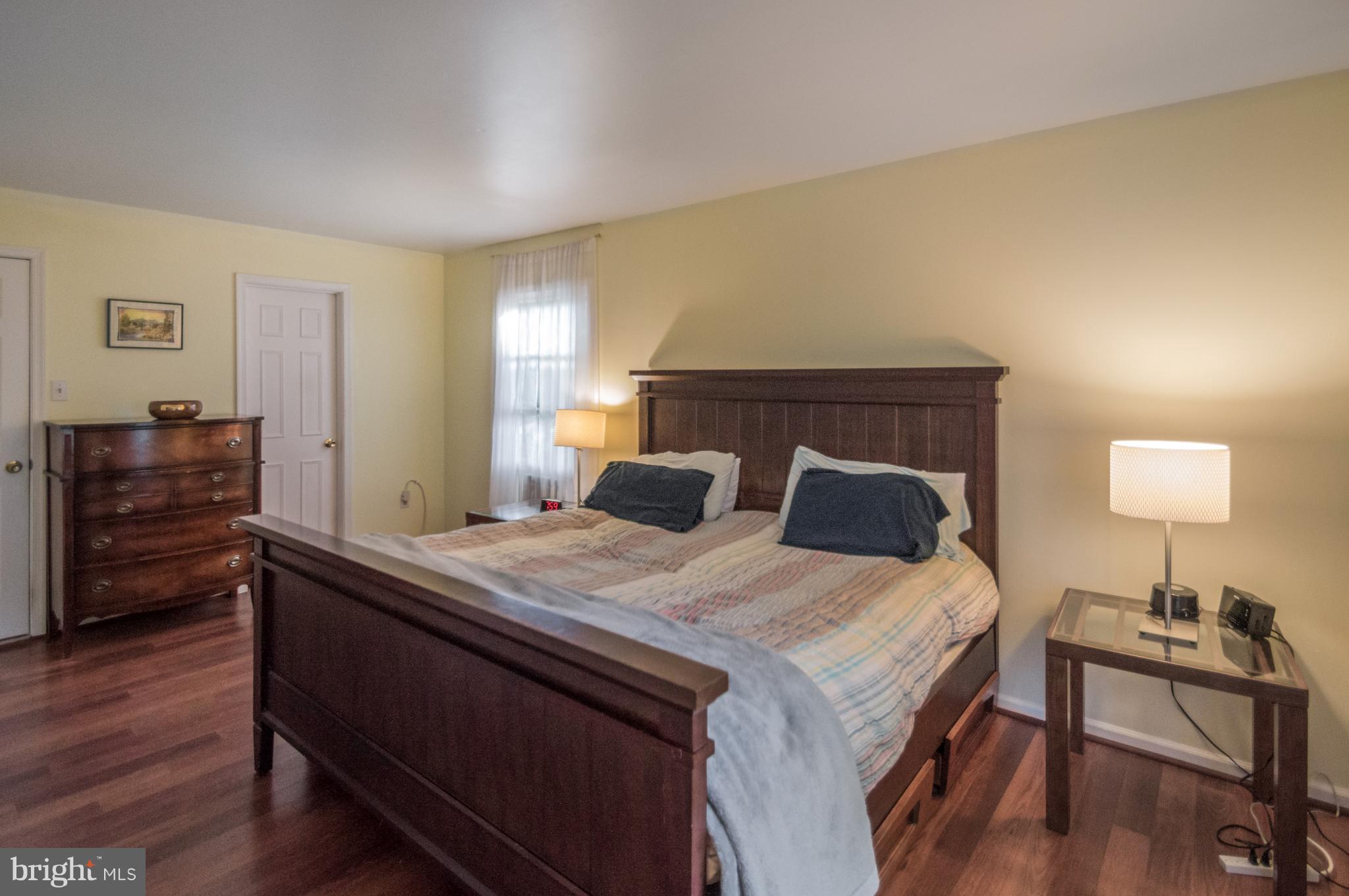 3812 Pippins Place Point of Rocks, MD 21777 - Photo 8 of 19 a bed room with a bed and a lamp