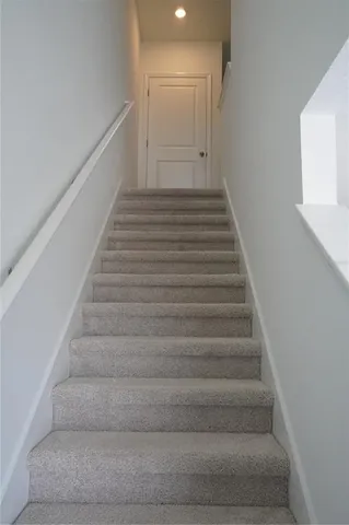 a view of a small space with wooden floor