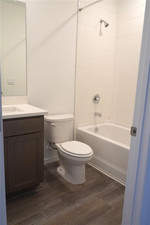 2476 Riversong Ldg Lane Wesley Chapel, FL 33543 - Photo 13 of 22 a bathroom with a toilet a sink and bathtub