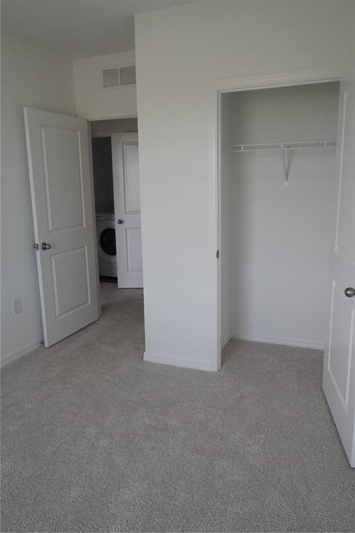 2476 Riversong Ldg Lane Wesley Chapel, FL 33543 - Photo 15 of 22 wooden floor and closet in a room