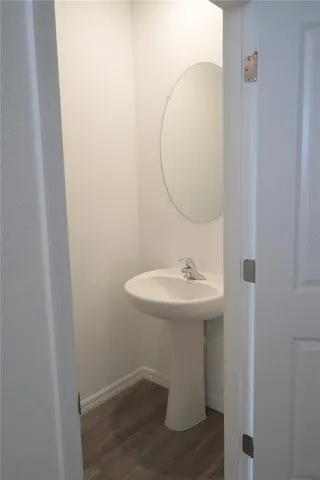 a bathroom with a sink and mirror