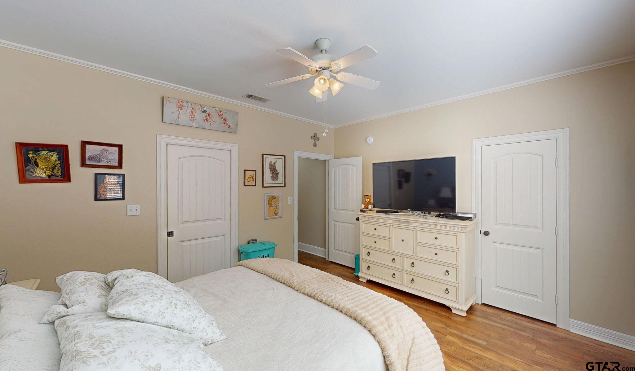 18488 Bluebird Circle Flint, TX 75762 - Photo 30 of 47 a bedroom with a bed and a flat screen tv