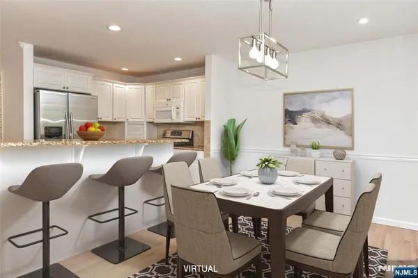 a view of a dining room with furniture and chandelier