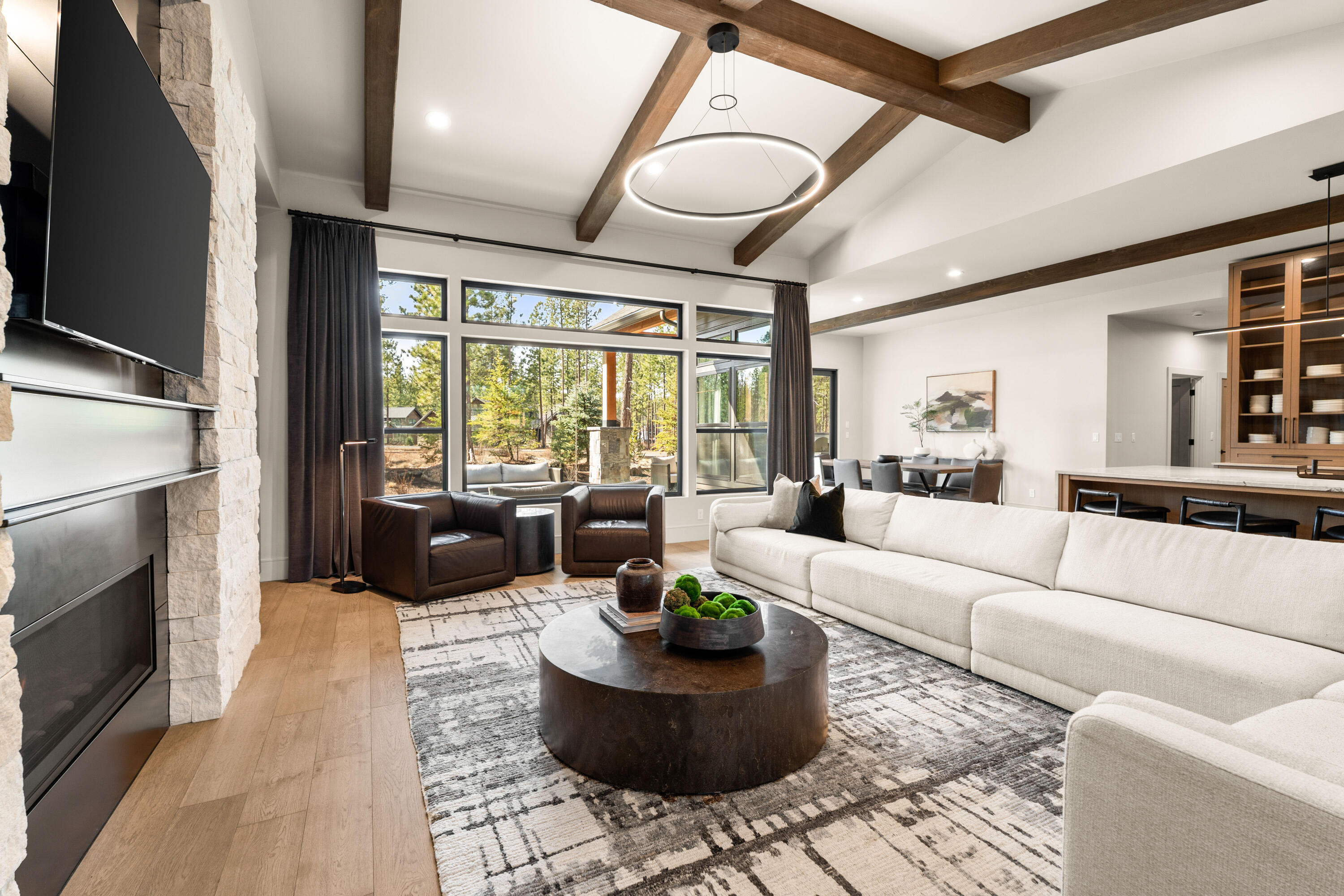 56350 Mirror Rock Loop, Unit 360 Bend, OR 97707 - Photo 2 of 86 Designed with vaulted ceilings, warm wood beams, and expansive windows, the home blends rustic charm with refined modern touches.