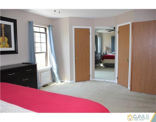 401 Maplecrest Road Edison, NJ 08820 - Photo 14 of 20 a bedroom with a bed and a dresser