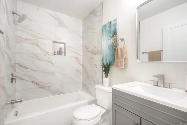 a bathroom with a sink a toilet and a bathtub