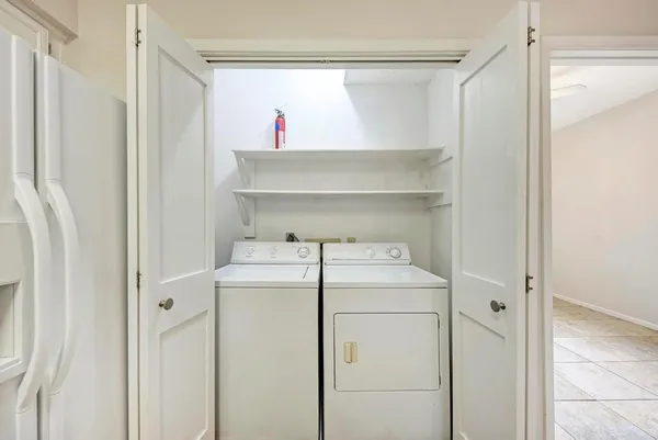 a utility room with dryer and washer